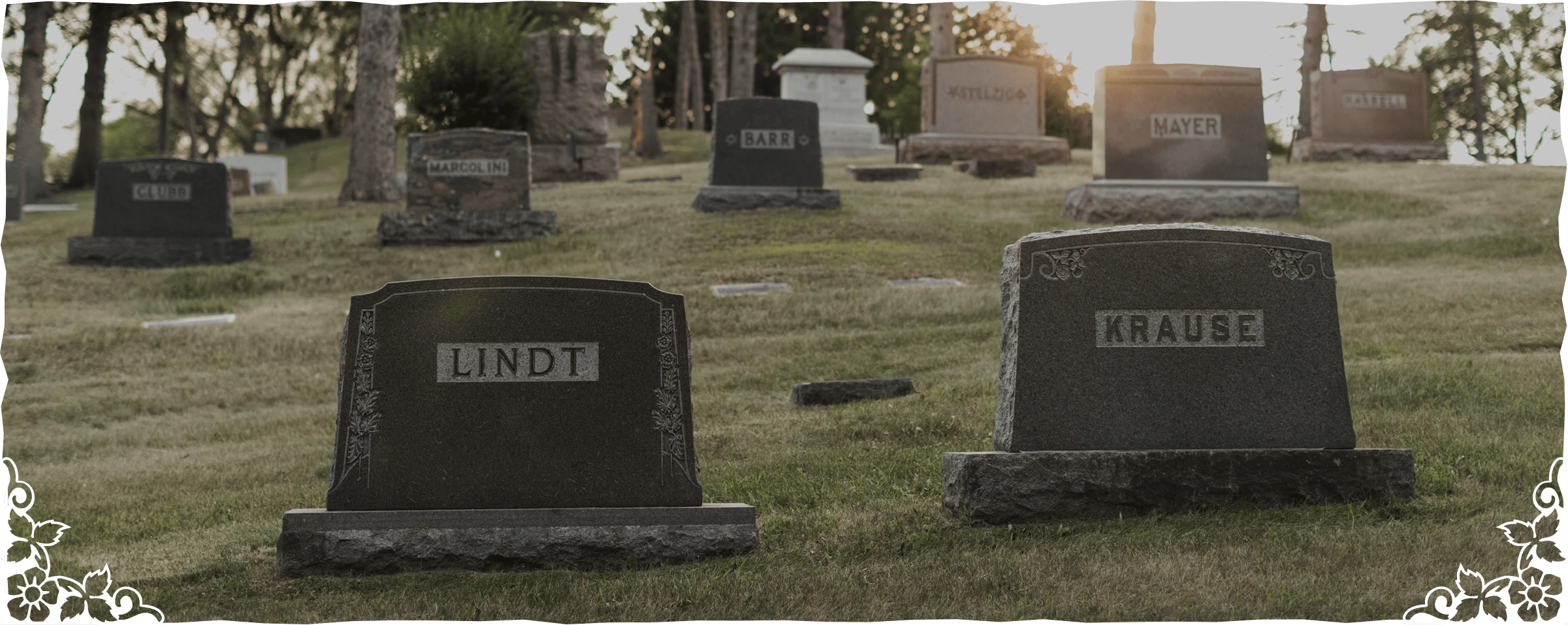 Cemetery With Multiple Headstones And Grave Markers On Grassy Hillside (1)