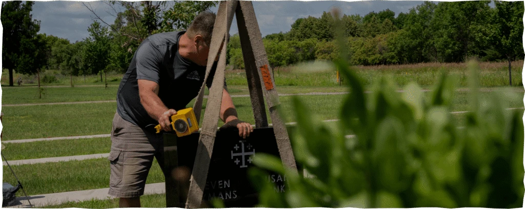 Man Installing A Headstone