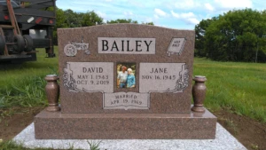 Upright Colonial Rose memorial with Colonial Rose granite turned vases, porcelain photo, and granite foundation